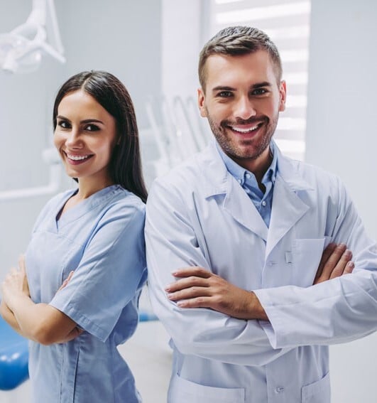 Dental benefits enrollment assistance An HR representative providing assistance with dental clinic employee benefits enrollment.